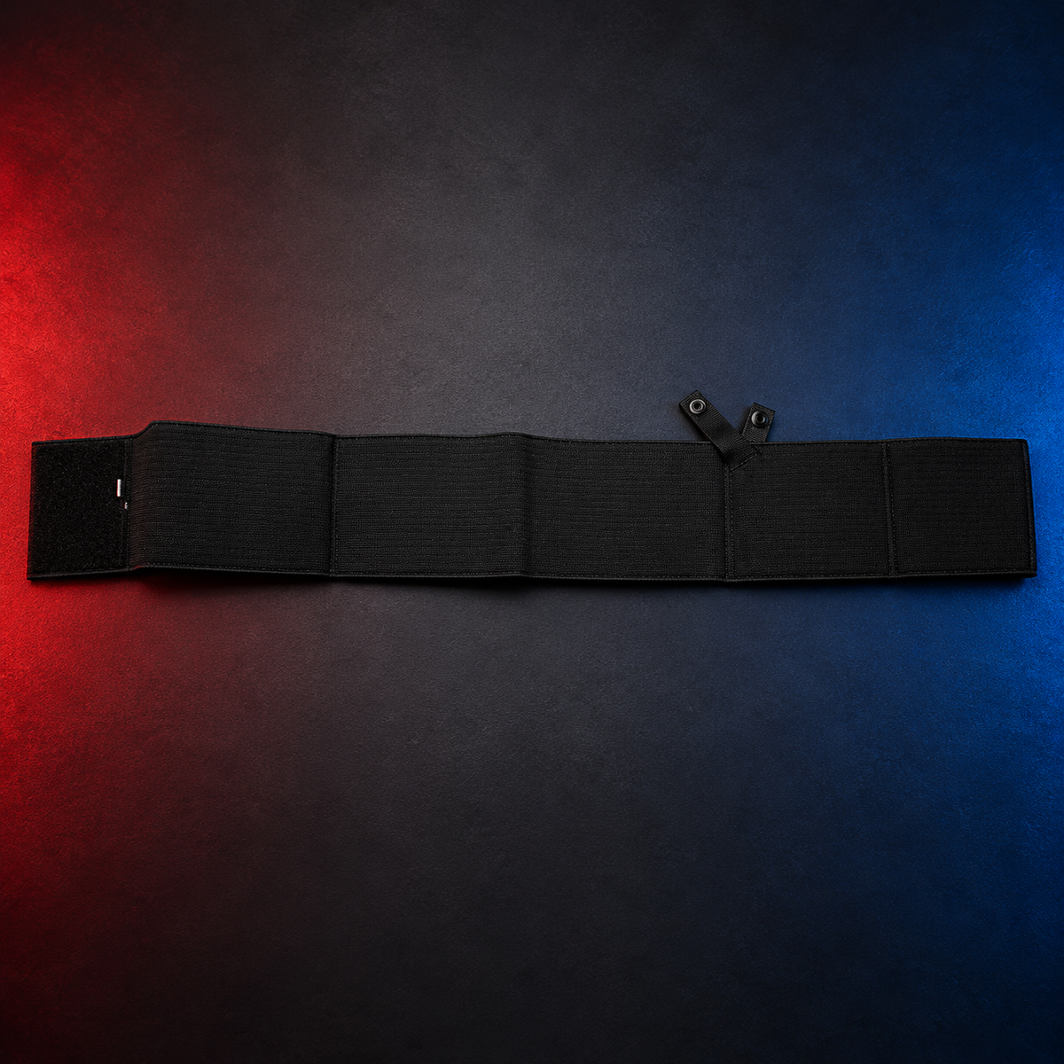 Large black body belt holster on a red-and-blue studio background